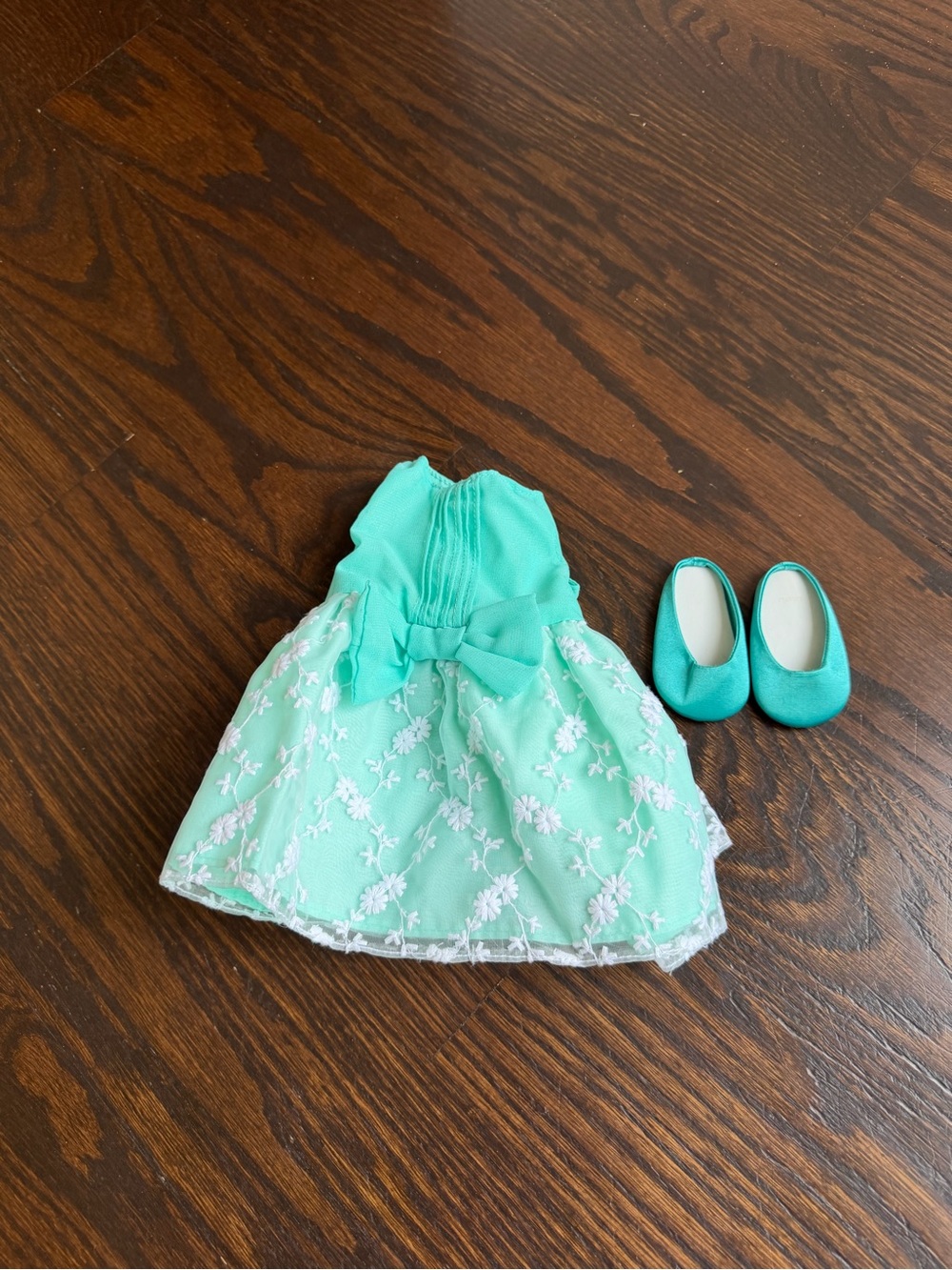 Our Generation turquoise doll dress with a bow and matching slip-on shoes